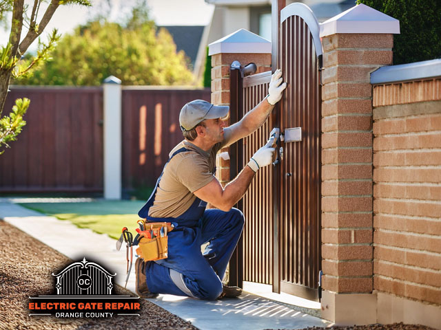 male technician performing custom gate installation