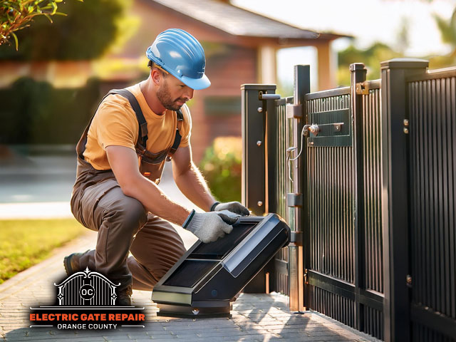 male technician performing electric gate maintenance